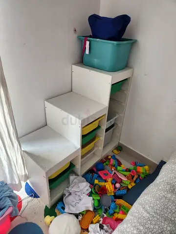 White modular baby storage unit with colored bins - good used condition