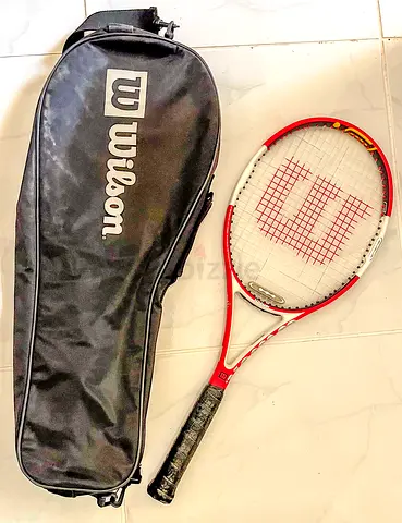 Wilson red tennis racket with cover - used