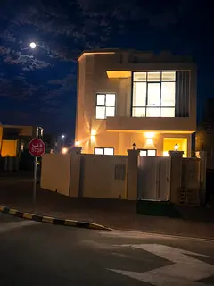 Villa for sale in Al Zahia area, Ajman: 6 master bedrooms, a majlis, and a living room with a modern