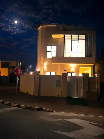 Villa for sale in Al Zahia area, Ajman: 6 master bedrooms, a majlis, and a living room with a moder