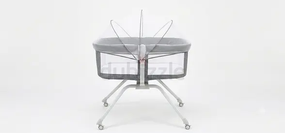 Grey bedside bassinet with wheels — compact newborn sleeper
