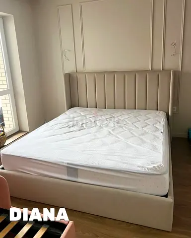 Beige upholstered double bed frame