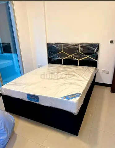 Nee Queen size upholstered bed with mattress