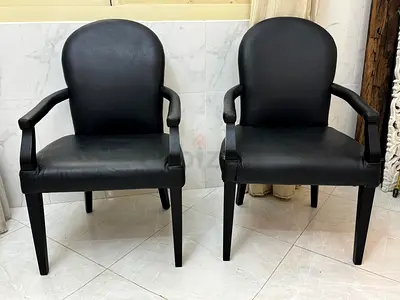 The One Elegant Black Leather Arm Chairs