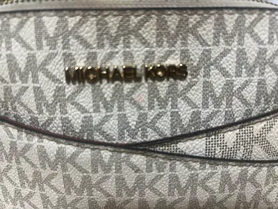 Michael Kors signature monogram crossbody bag. Can show the bill to prove it’s original Handbag.
