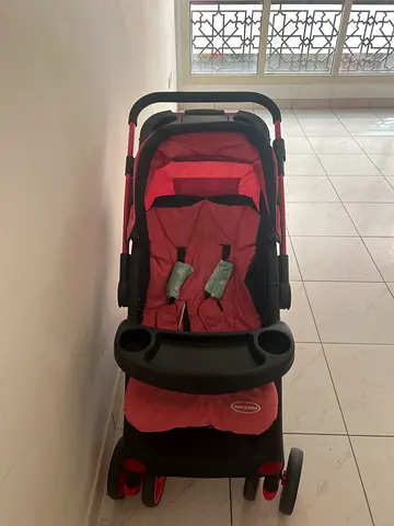 Red baby stroller/pram in good condition