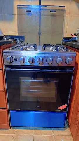 Used freestanding gas oven and 4-burner stove in good working condition