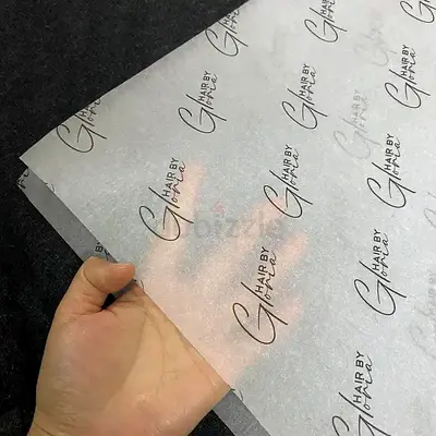 Pack of translucent branded tissue/wrapping paper sheets — unused