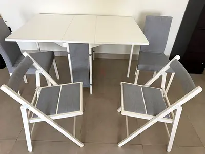 IKEA White extendable dining table with 4 grey chairs (folding + upholstered)