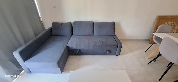 IkEA L-shaped grey fabric sofa bed