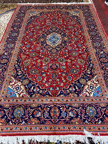 Traditional Persian-style Red Area Rug with Fringe