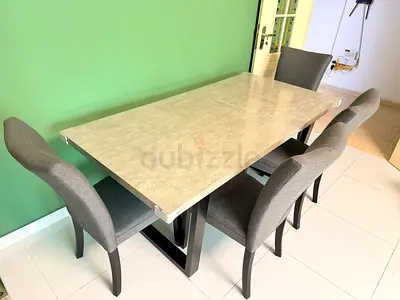 6-seater dining table with marble-look top and 4 grey upholstered chairs