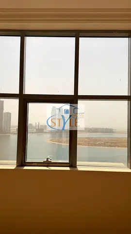 Apartment for sale, two bedrooms and a living room. The apartment features a detailed view of Khan Lake and another view of Al Qasba Canal.