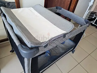 Nested cot with changing table