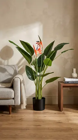 Tall artificial bird of paradise plant in black pot — perfect living room décor