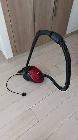 Compact red canister vacuum cleaner - good working condition