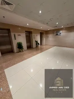 Two-bedroom apartment with a living room and a balcony offering a sea view of Ajman Creek available