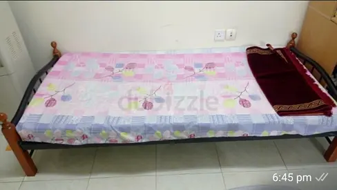Single metal frame bed with wooden posts - good condition