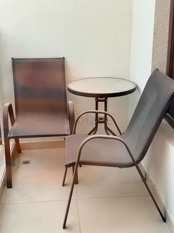 Small outdoor bistro set — round table with two mesh chairs