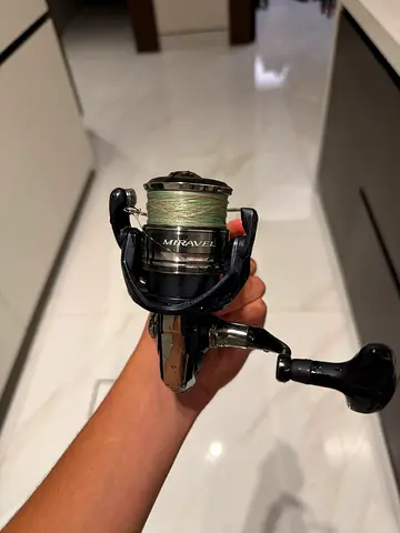 Used Mitchell Spinning Reel with Line - Good Condition