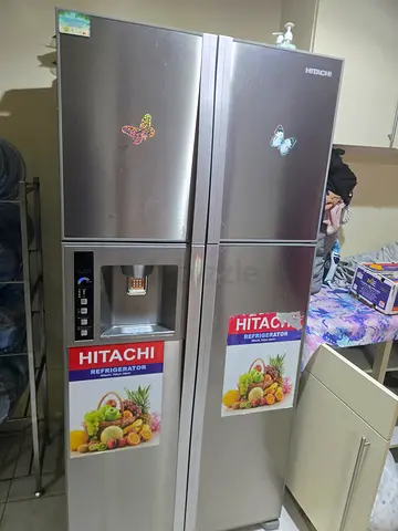 Hitachi double-door stainless steel refrigerator with water dispenser - good condition
