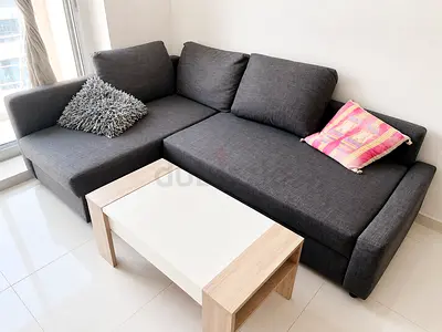 IKEA - Dark grey L-shaped fabric sofa with storage — good condition