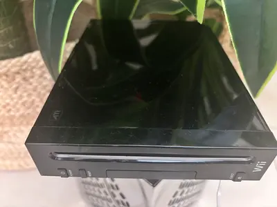 Black Nintendo Wii console with many games
