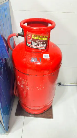 Large Gas cylinder almost full with long tube and regulator 200 AED - in ajman