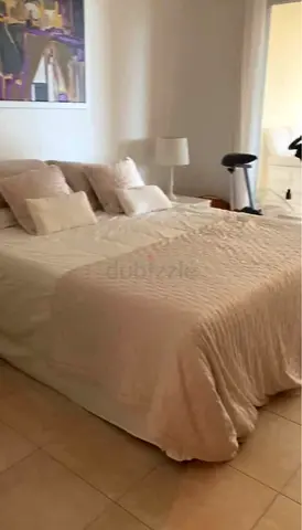 King-size bed frame with mattress and bedding - neutral beige set