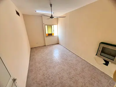 Balcony with an open view - Central air conditioning - Prime location on the main road - Easy access to Sharjah and Dubai