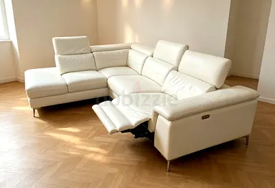 Cream leather L-shaped reclining sectional sofa, 4-seater
