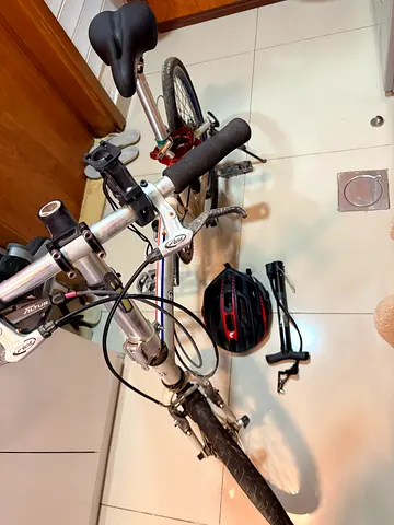 Folding Bike with Helmet and Pump * front tire needs to be replaced*