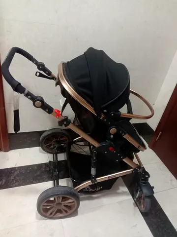 Stroller pram in good condition with adjustable handle and storage basket