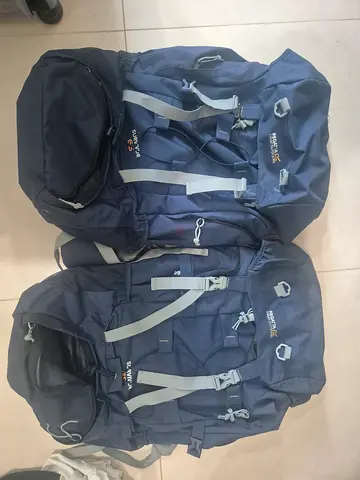 Pair of large navy Regatta hiking backpacks - sturdy camping rucksacks