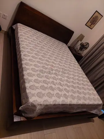 Double Queen bed with bedside table and Intercoil mattress
