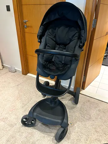 Stokke. Lightly used black pram stroller smooth ride. Facing both sides. From 6M till 3y