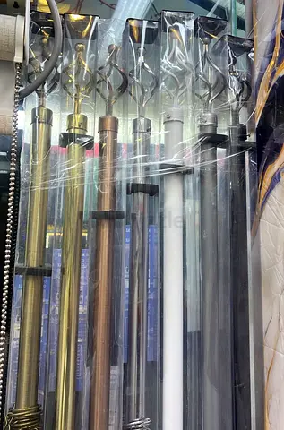 Set of new metal curtain rods with decorative finials