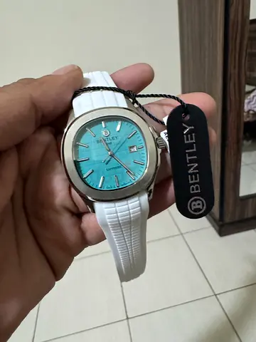 Bentley wristwatch with turquoise dial and white rubber strap