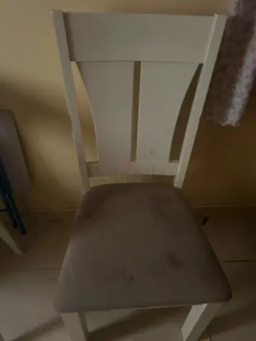 White wooden dining chair with grey padded seat - used