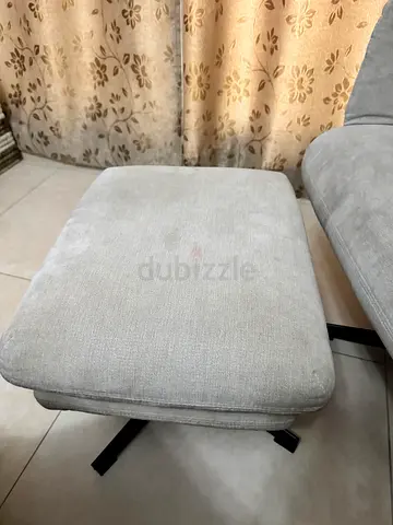 Rotating chair with foot rest stool