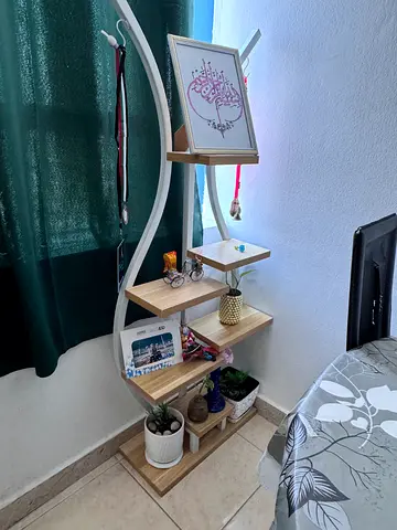 Wooden corner shelf unit with curved frame — light oak finish
