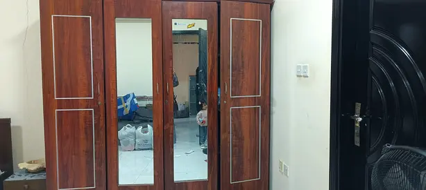 Solid Wood 4-Door Wardrobe with Mirror – Good Condition
