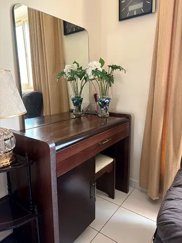 Dark wood dressing table with mirror and stool