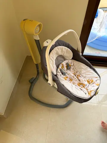 Baby swing/rocker in good condition with removable cover