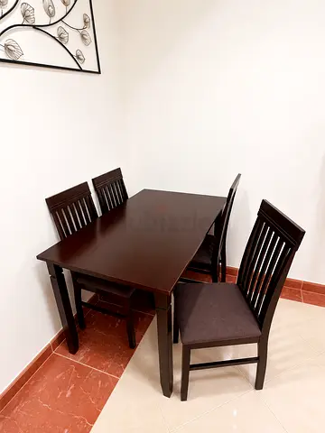 Dark Wood 4-Seater Dining Table with Cushioned Chairs