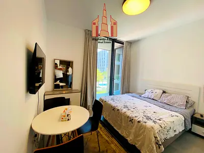Luxurious furnished studio with balcony ready to move pool view