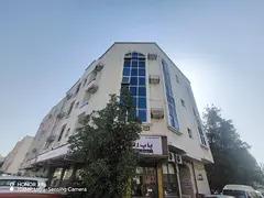 Corner residential building for sale in Muwailih Commercial.