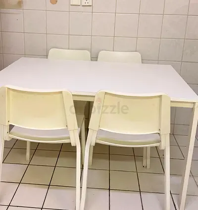 White dining table with 4 matching chairs - simple modern set