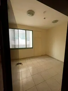 For Rent in Al Qasimia Al Nad: 2BR hall apartment, central AC, built-in wardrobes, 2 bathrooms, AED