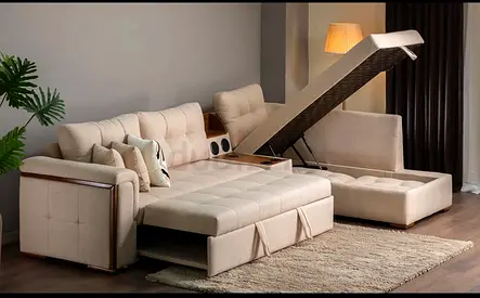 Cream L-shaped Storage Sofa Bed with Ottoman, Cup Holders and integrated speakers.